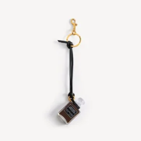 Charm i form af en miniatureparfumeflaske i sort