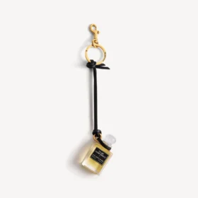 Charm i form af en miniatureparfumeflaske i sort