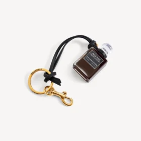 Charm i form af en miniatureparfumeflaske i sort