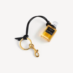 Charm i form af en miniatureparfumeflaske i sort