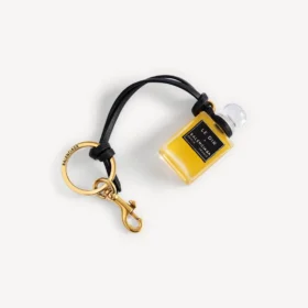 Charm i form af en miniatureparfumeflaske i sort