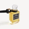 Charm i form af en miniatureparfumeflaske i sort