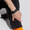Logo-armbånd med mønter “Black” 656450-TZ10Z-1268