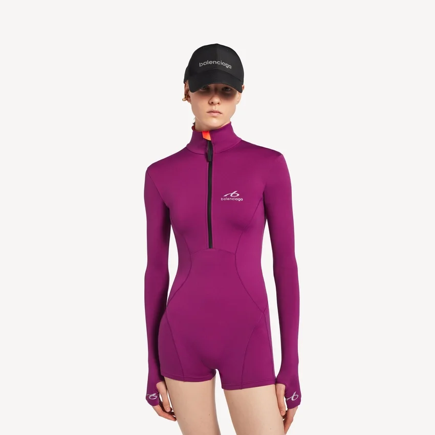Techwear-bodysuit til kvinder med korte lange ærmer i violet/orange Techwear-bodysuit til kvinder med korte lange ærmer i violet/orange